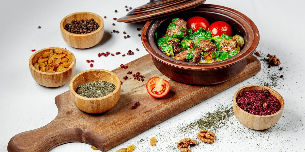 fried-meat-with-greens-tomatoes-clay-pot-min-min